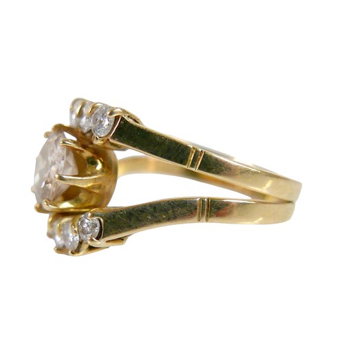 2 - A ten stone diamond 18ct gold ring, the large central stone, 7.3mm diameter, approximately 1.5ct, wi... 