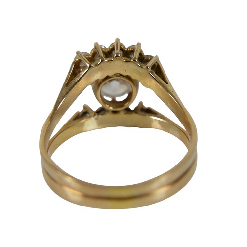 2 - A ten stone diamond 18ct gold ring, the large central stone, 7.3mm diameter, approximately 1.5ct, wi... 