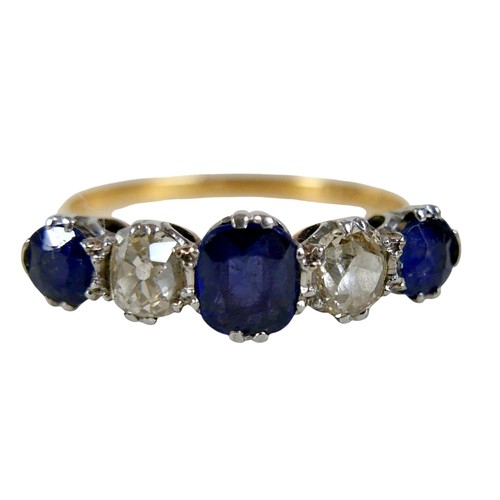 4 - An 18ct yellow gold and platinum five stone diamond and sapphire ring, the central oval cut sapphire... 
