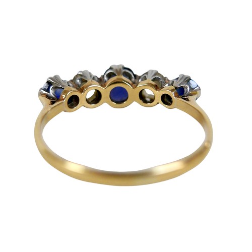 4 - An 18ct yellow gold and platinum five stone diamond and sapphire ring, the central oval cut sapphire... 