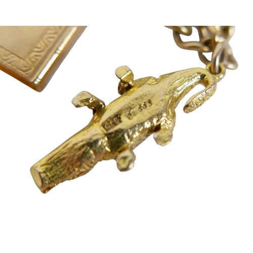 16 - A 9ct yellow gold charm bracelet with eight charms, 20.7g.