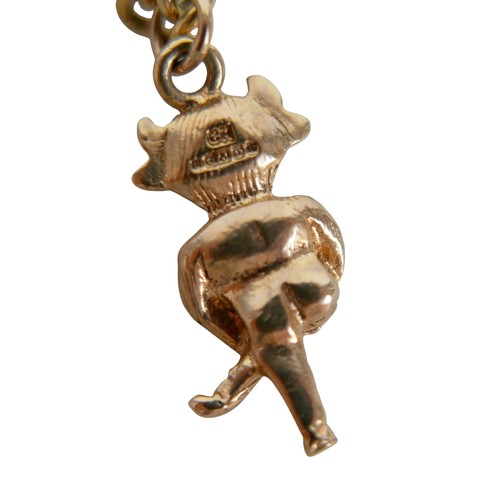 16 - A 9ct yellow gold charm bracelet with eight charms, 20.7g.