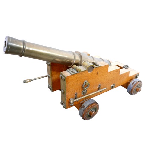 353 - A pair of engineer made 10 bore brass signal cannons on oak carriages, with tapering barrels divided... 