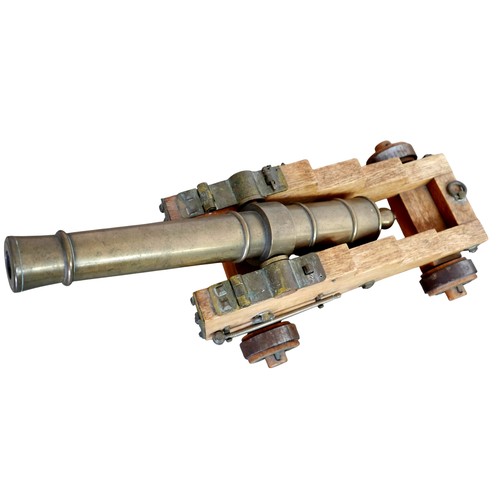 353 - A pair of engineer made 10 bore brass signal cannons on oak carriages, with tapering barrels divided... 