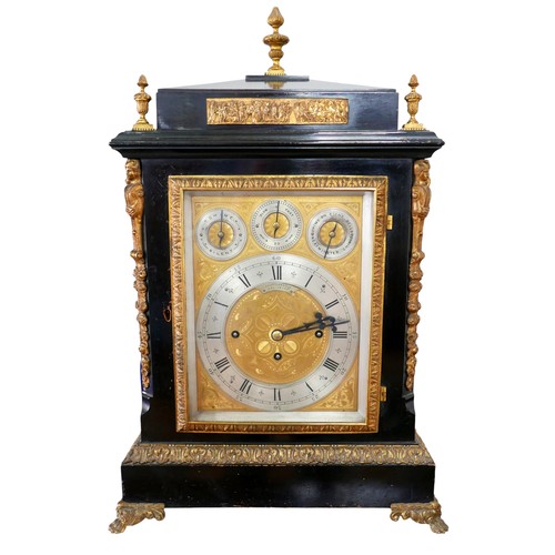 A George III ormolu mounted ebonised musical table clock by Shuttleworth of Salisbury, with a triple fusee movement chiming on eight belts, striking on one gong, with repeat, the  gilt engraved dial with silvered chapter ring and roman hour numerals and arabic minute numerals, with chime, silent, and Westminster chimes and chime on eight bells adjustment, standing on claw feet, 44 by 26  by 67cm high, in working order.