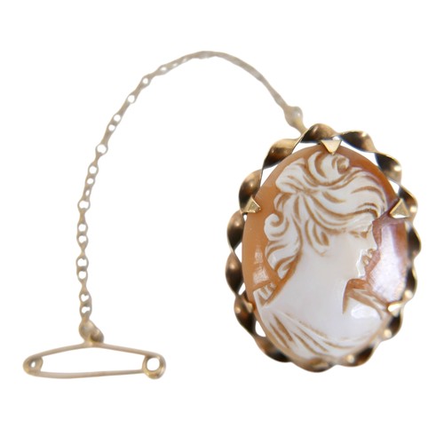 29 - A 19th century 9ct gold scroll brooch, 4cm, 2.4g, plus a 9ct gold mounted carved shell cameo brooch ... 