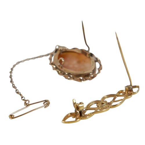 29 - A 19th century 9ct gold scroll brooch, 4cm, 2.4g, plus a 9ct gold mounted carved shell cameo brooch ... 
