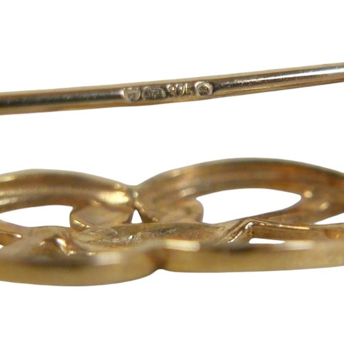 29 - A 19th century 9ct gold scroll brooch, 4cm, 2.4g, plus a 9ct gold mounted carved shell cameo brooch ... 