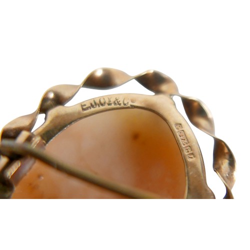 29 - A 19th century 9ct gold scroll brooch, 4cm, 2.4g, plus a 9ct gold mounted carved shell cameo brooch ... 