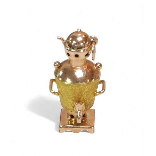 32 - A 14ct gold samovar charm, stamped '14' to its base, 1.1 by 1.3 by 3.1cm high, 3.6g.