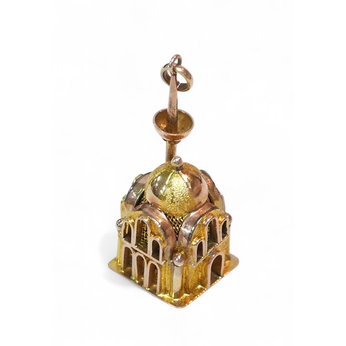 52 - A yellow metal Mosque form charm, stamped 14 to its base, 1.4 by 1.4 by 3cm high, 7.1g.