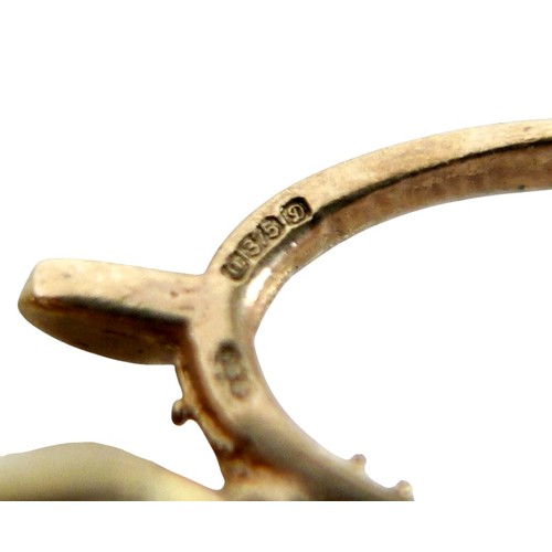 15 - A 9ct gold charm bracelet with heart lock, circular gold Taurus charm, wishbone charm, carriage with... 