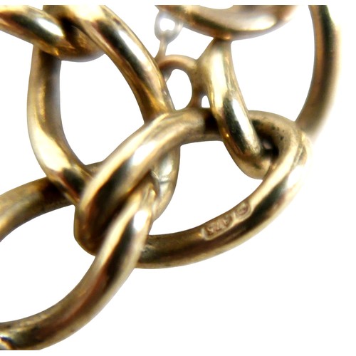 15 - A 9ct gold charm bracelet with heart lock, circular gold Taurus charm, wishbone charm, carriage with... 