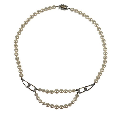 41 - A pearl necklace with silver gilt clasp, three pearl bracelets (one with unmarked gold metal links),... 