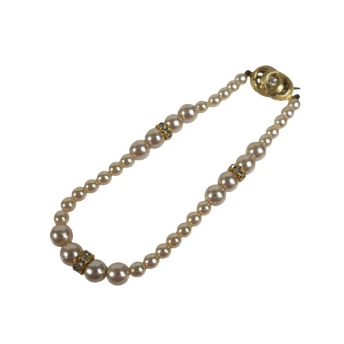 41 - A pearl necklace with silver gilt clasp, three pearl bracelets (one with unmarked gold metal links),... 