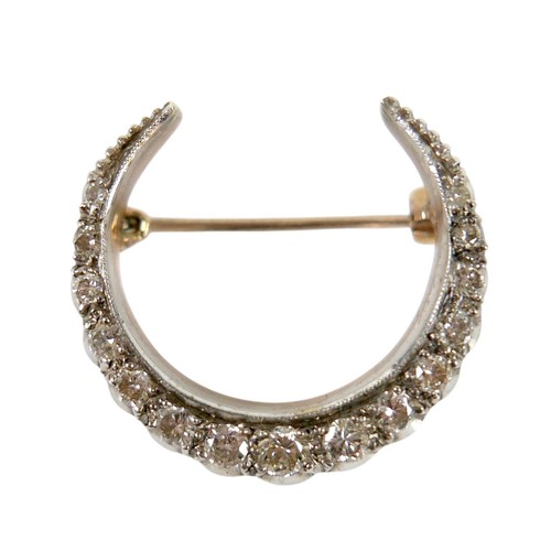 51 - A Victorian 9ct gold and diamond crescent shaped brooch, set with fifteen graduated diamonds, the la... 
