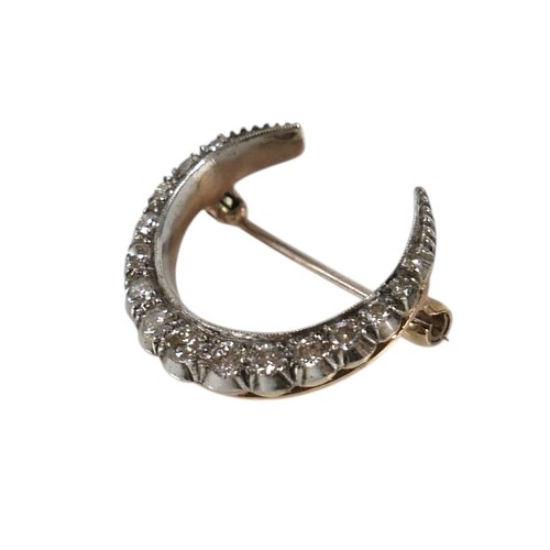 51 - A Victorian 9ct gold and diamond crescent shaped brooch, set with fifteen graduated diamonds, the la... 