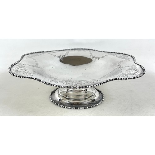 119 - A George V silver footed bowl, with a shaped top engraved with garlands, Stephenson & Sons, Sheffiel... 