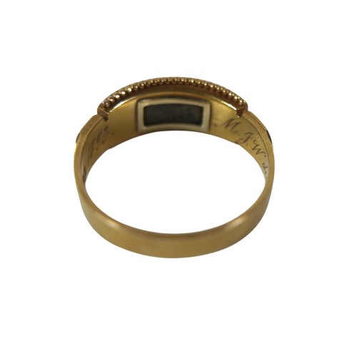 44 - A Victorian 18ct yellow gold mourning ring, set with nine seed pearls in a black enamel surround, en... 