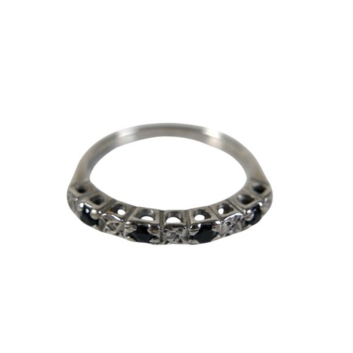 46 - A group of four white metal rings, comprising one set with a row of six marquise cut emeralds, each ... 