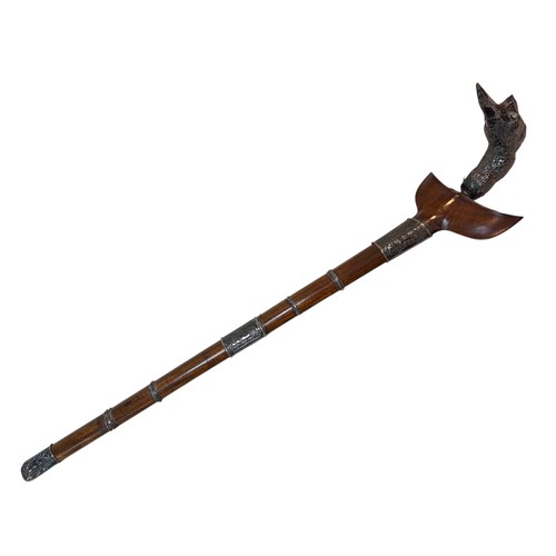 226 - An Indonesian Kris, ornate bird form pommel, blade length 53cm, its scabbard with metal mounts, over... 