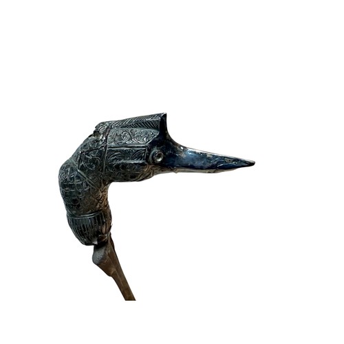 226 - An Indonesian Kris, ornate bird form pommel, blade length 53cm, its scabbard with metal mounts, over... 