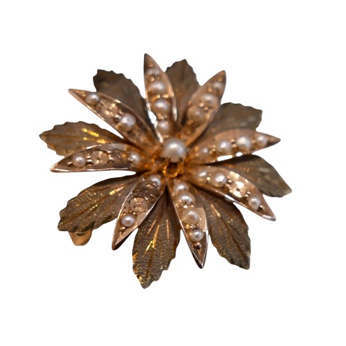 33 - A 10ct gold seed pearl floral design brooch, 2.5cm diameter, 4.5g.