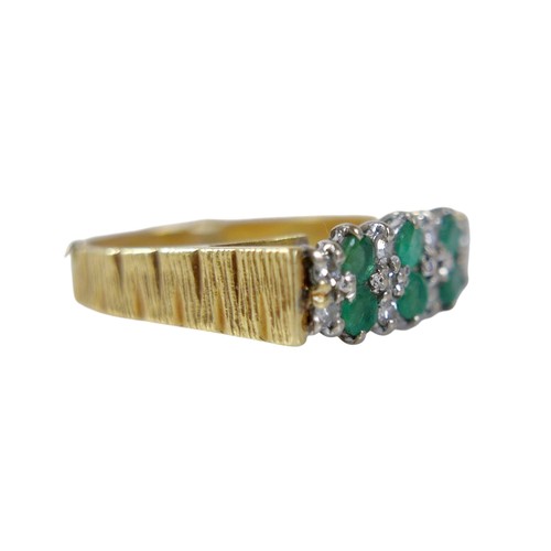 63 - An 18ct gold emerald and diamond ring, the six round cut emerald stones, each approximately 2mm diam... 