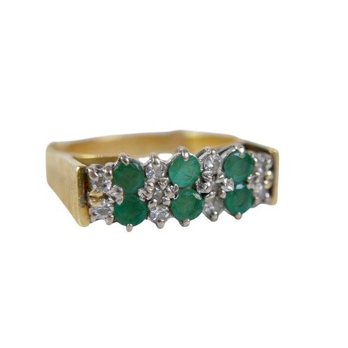 63 - An 18ct gold emerald and diamond ring, the six round cut emerald stones, each approximately 2mm diam... 