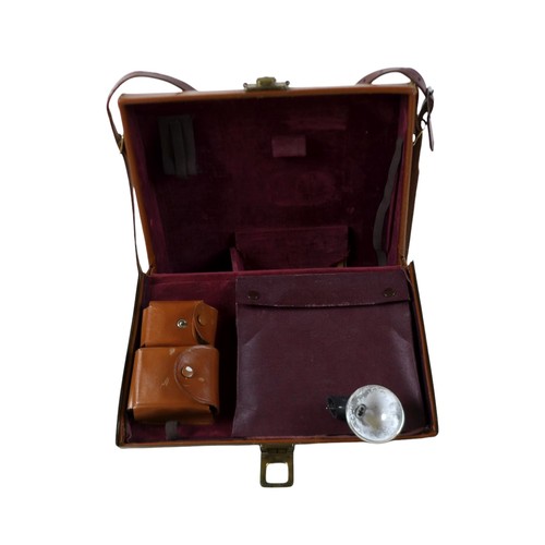 169 - A collection of nine vintage cameras comprising a Polaroid land camera, Voigtlander Vito B and Promi... 