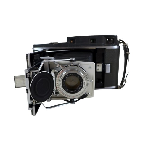 169 - A collection of nine vintage cameras comprising a Polaroid land camera, Voigtlander Vito B and Promi... 