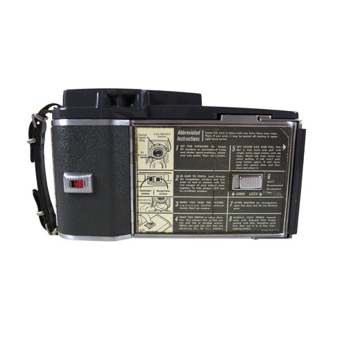 169 - A collection of nine vintage cameras comprising a Polaroid land camera, Voigtlander Vito B and Promi... 