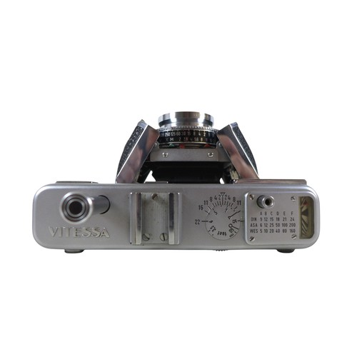 169 - A collection of nine vintage cameras comprising a Polaroid land camera, Voigtlander Vito B and Promi... 