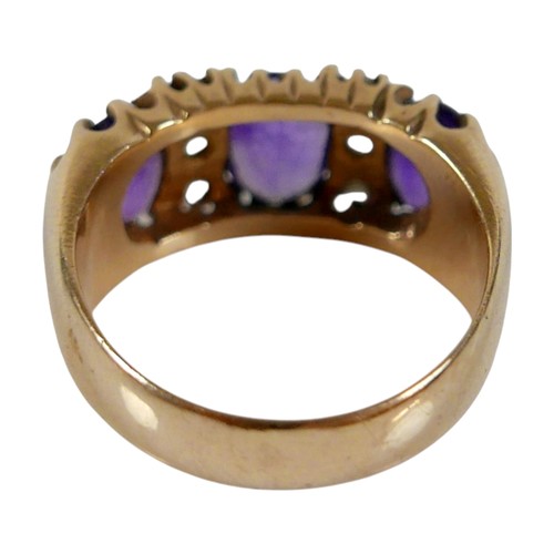 58 - A 9ct yellow gold amethyst and diamond ring, set with three oval cut amethysts and six small diamond... 