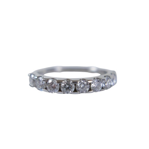 23 - A diamond and moissanite silver ring, set with five round cut diamonds and four moissanites, each 2.... 