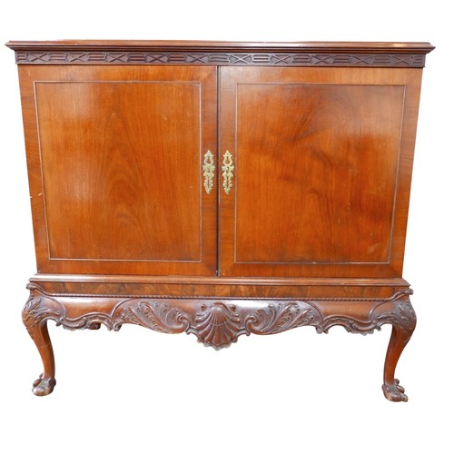 483 - An Irish George III style linen cabinet on stand possibly by Hicks, with a blind fretwork frieze abo... 