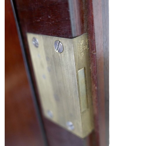 483 - An Irish George III style linen cabinet on stand possibly by Hicks, with a blind fretwork frieze abo... 
