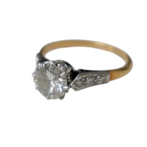 1 - An 18ct gold, platinum and diamond ring, the central brilliant cut diamond approx 1.6ct, each should... 