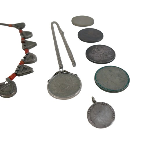 130 - A small collection of Georgian and later coins and a tribal necklace, approximately 2.0toz of silver... 