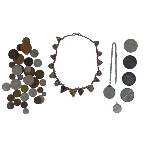 130 - A small collection of Georgian and later coins and a tribal necklace, approximately 2.0toz of silver... 