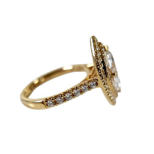 1 - An 18ct yellow gold and diamond ring, set with a 1.0ct marquise cut diamond, 9.8 by 5.4 by 3.3mm, co... 