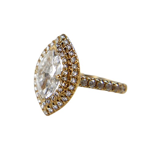 1 - An 18ct yellow gold and diamond ring, set with a 1.0ct marquise cut diamond, 9.8 by 5.4 by 3.3mm, co... 