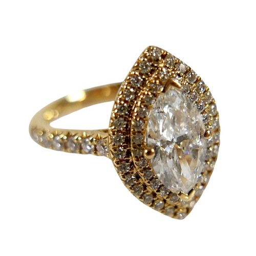 1 - An 18ct yellow gold and diamond ring, set with a 1.0ct marquise cut diamond, 9.8 by 5.4 by 3.3mm, co... 