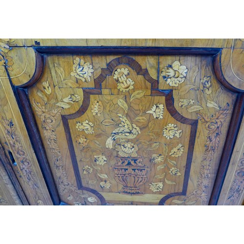 451 - A Dutch early 18th century marquetry sideboard, with twin cupboard doors opening to reveal internal ... 