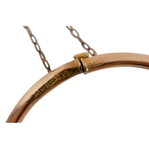 50 - A 9ct yellow gold diamond and ruby hollow bangle 6 x 6.5cm, weight 4.7g, with box.