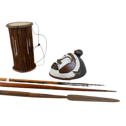 219 - A collection of tribal items comprising drum, mask, spear, bow, and four arrows, one arrow 137cm lon... 