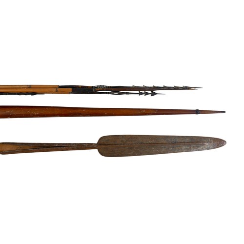 219 - A collection of tribal items comprising drum, mask, spear, bow, and four arrows, one arrow 137cm lon... 