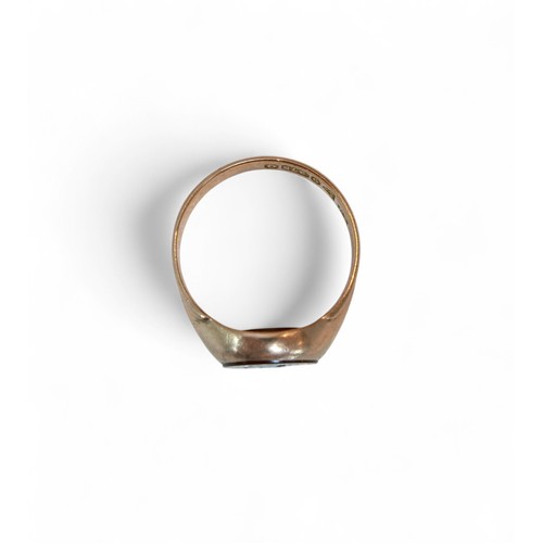 33 - A 9ct gold and a red stone inlaid signet ring, size P, 4.2g.