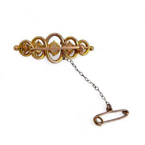 40 - A 15ct gold and five stone opal bar brooch, largest three central opals each approximately 6 by 4.5m... 