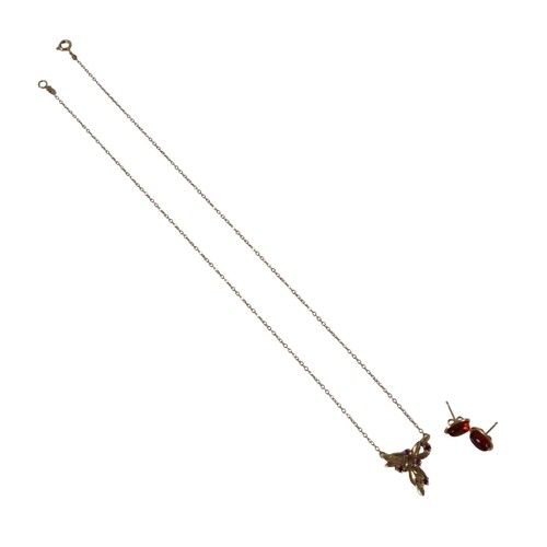 48 - A 9ct yellow gold ruby necklace and a pair of 9ct earrings the necklace head of foliate form 16 x 15... 